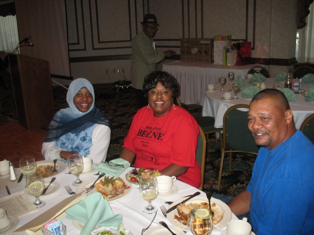 Cousin Leticia Love and family sits for a brief moment to enjoy a meal. 